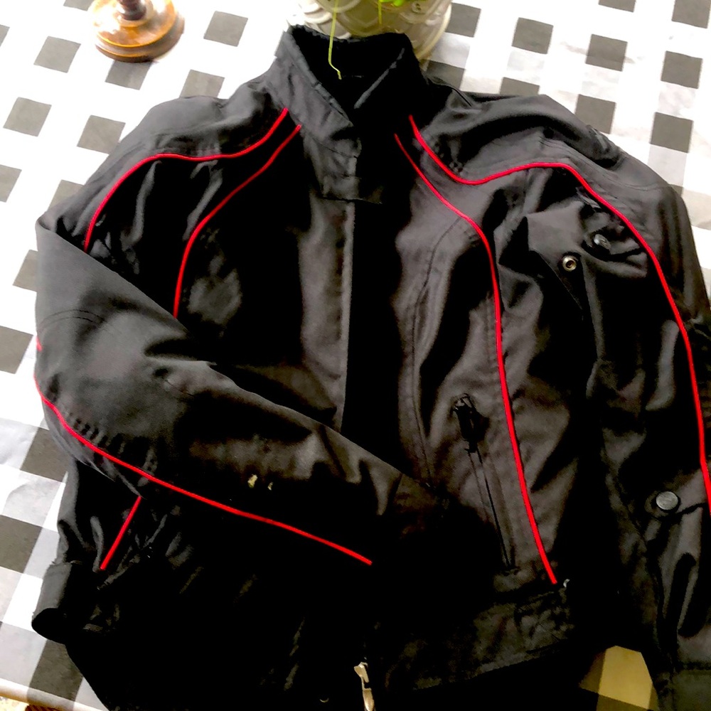 Field sheer ladies motorcycle jacket M/L with zip in liner and pads.